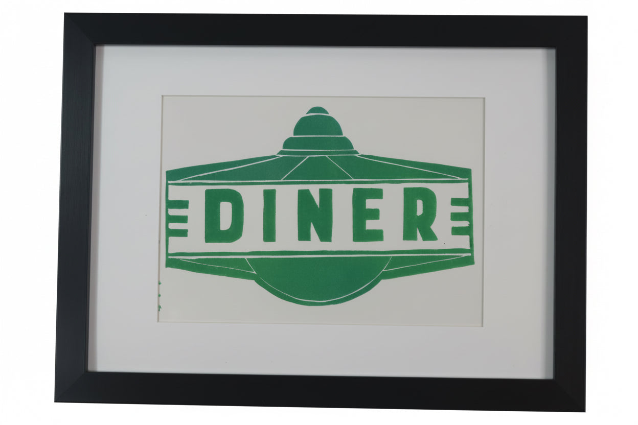 Framed artwork with a green 'Diner' sign on a white background