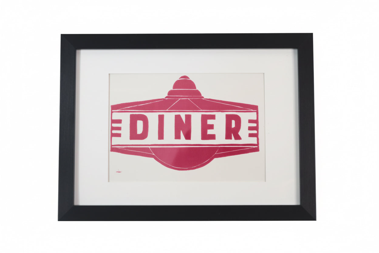 Framed artwork with 'Diner' design on a white wall